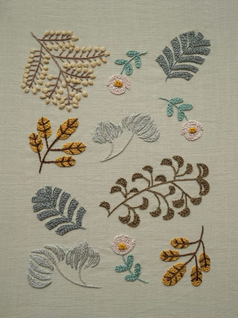 Botanical Observation No. 2, a hand embroidery sampler by lissyluo featuring various leaves and flowers in earthy tones on a neutral linen background.