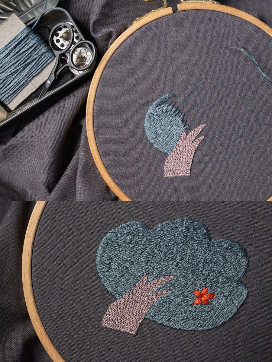 The embroidery process for 'Shelter from the Rain,' showing the piece mounted in a hoop with tools nearby.